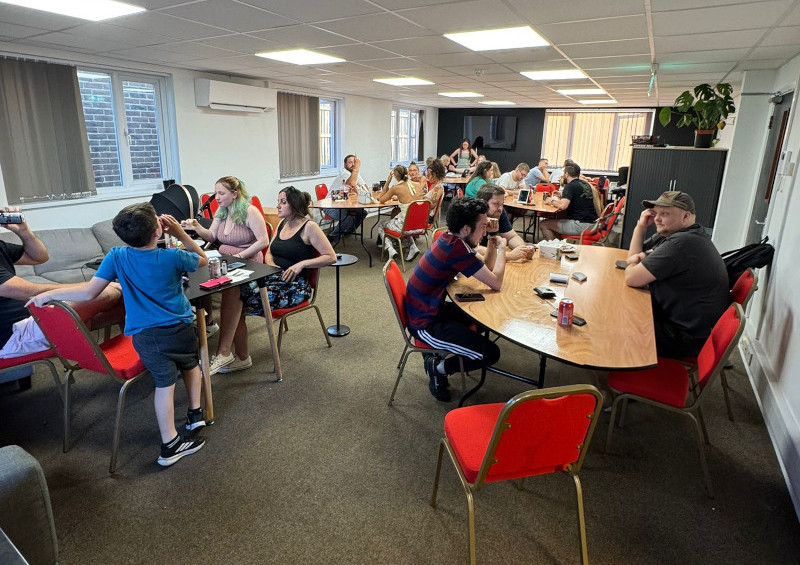 A group of people taking part in the monthly quiz